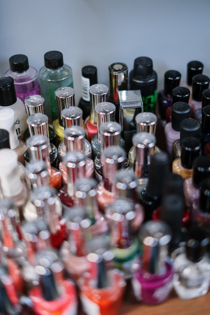 portfolio-03 Close-up of assorted nail polish bottles in various colors, ideal for salon and cosmetic use.